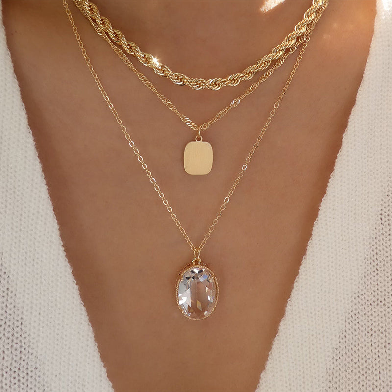 Triple-Layered Gold Necklace with Crystal Pendant