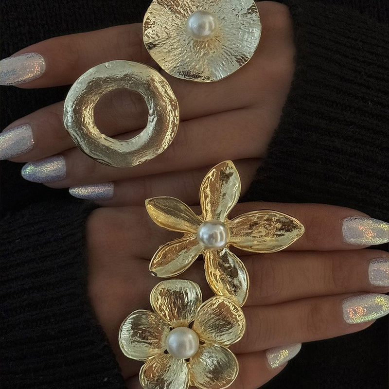 Gold pearl rings with different shapes and designs