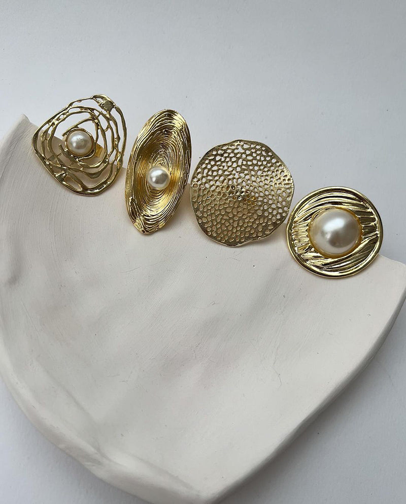 Gold pearl rings with different shapes and designs