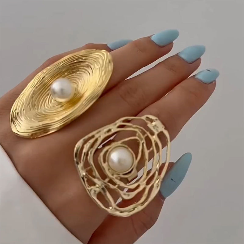 Gold pearl rings with different shapes and designs