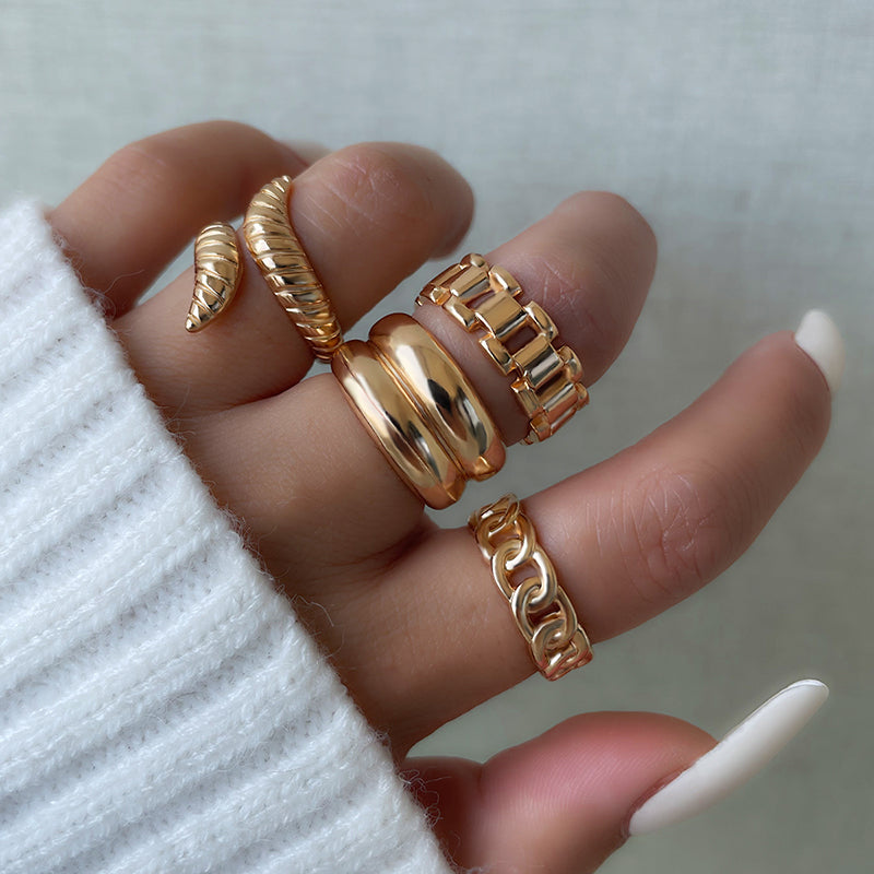 Gold-plated snake-shaped geometric ring for stacking, featuring an artistic and vintage-inspired design.