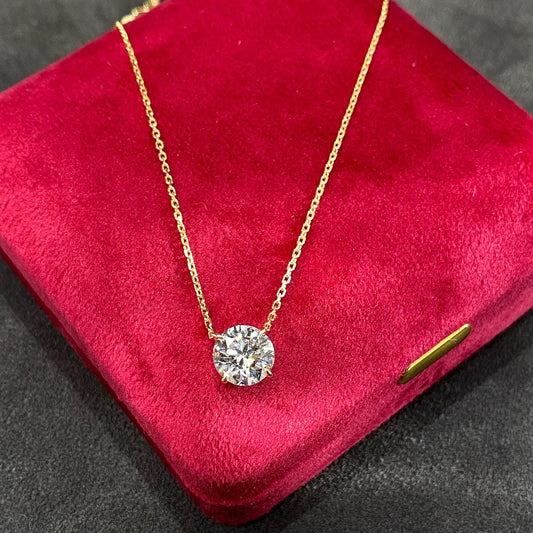 Lab grown diamond pendant necklace set in 18k white gold with a floating colorless diamond, perfect for minimalist styles.