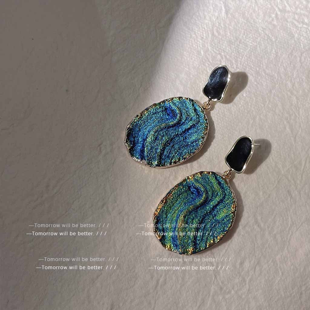 Light blue textured geometric earrings crafted from resin and alloy with an elegant retro style, featuring a high-end artistic touch.