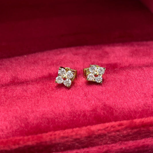 Front view of Mini Four Leaf Clover Lab Grown Diamond Stud Earrings in 18K solid gold, featuring colorless diamonds in a minimalist floral design