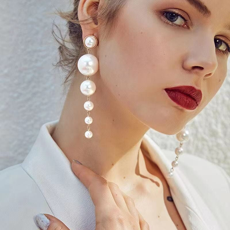 Minimalist pearl long tassel earrings made with alloy and a sleek electroplated finish, perfect for modern and trendy styles.