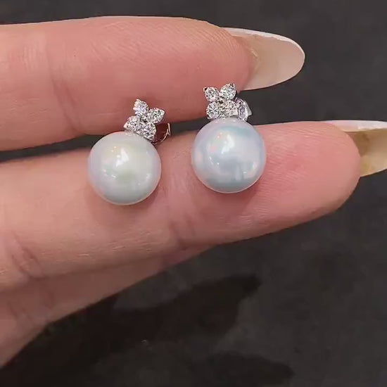 Sophisticated pearl earrings with 9-10mm genuine freshwater pearls and lab-grown diamonds, ideal as a timeless gift.