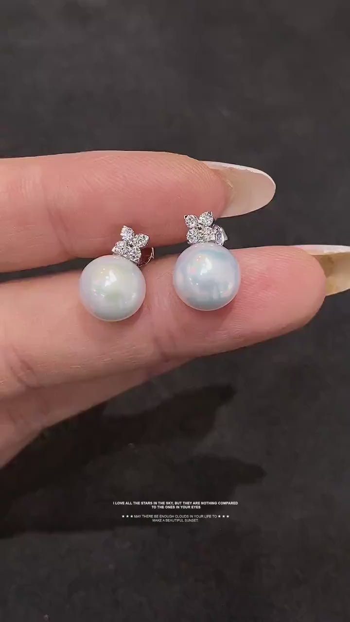 Sophisticated pearl earrings with 9-10mm genuine freshwater pearls and lab-grown diamonds, ideal as a timeless gift.