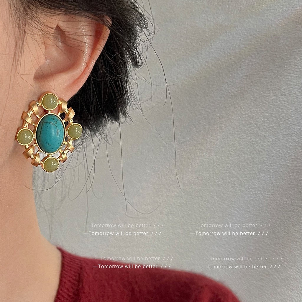 Retro-style turquoise earrings crafted with electroplated metal in a geometric shape, delivering a luxurious vintage-inspired look.